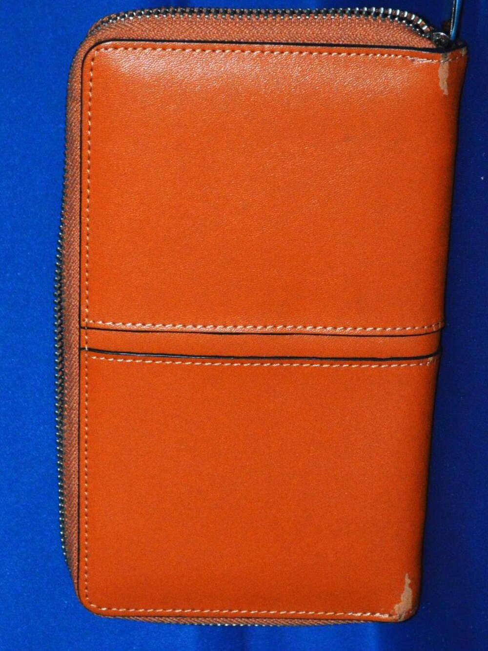 womans orange wallet